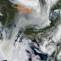 Satellite image showing smoke from Siberian forest fires reaching the North Pole August 3, 2021