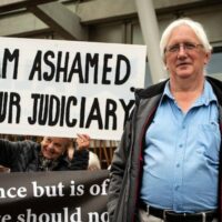 | Craig Murray poses with supporters outside the Scottish Parliament Photo The Scotsman | MR Online