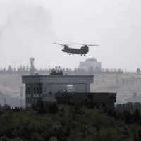 The New York Times (8/15/21) ran the next best thing to a photo of a helicopter taking off from the Kabul embassy roof: a photo of a helicopter flying over the embassy roof.