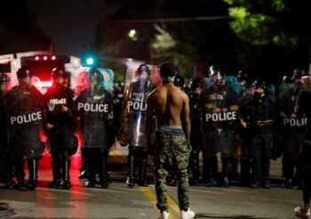 | Demonstrator protesting police brutality following the killing of Michael Brown in Ferguson Missouri in 2014 | MR Online