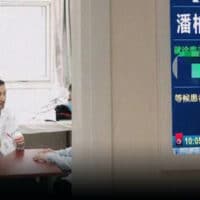 | Pan Bolin talks with a man at his clinic in Beijing | MR Online