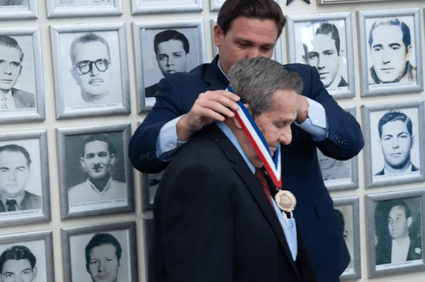 | Florida Governor Ron DeSantis pinning medal on CIA assassin Félix Rodríguez on September 16 2021 Source flgovcom | MR Online