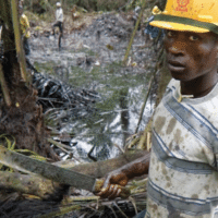 The photo shows an oil spill from an abandoned Shell Petroleum Development Company in Olobiri, Niger Delta (Ed Kashi, 2004). The image is taken from the cover of Wengraf’s book.