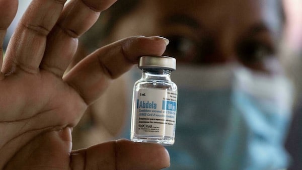 | Cuban health worker holding vial of Abdala vaccine | MR Online