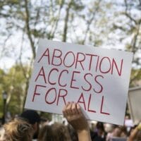 'Abortion access for all,' sign.