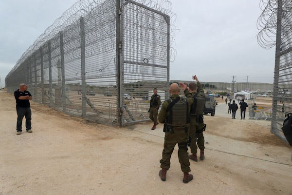 | ISRAELI SECURITY PERSONNEL GESTURE AT AN OPENING TO THE NEWLY COMPLETED UNDERGROUND BARRIER ALONG ISRAELS FRONTIER WITH THE GAZA STRIP IN EREZ SOUTHERN ISRAEL DECEMBER 7 2021 | MR Online