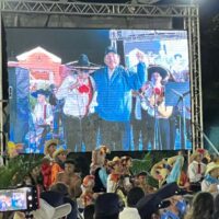 President Daniel Ortega shown dancing with musicians and supporters