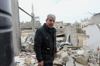 | THE OWNER OF A HOME DESTROYED BY AN ISRAELI AIRSTRIKE IN MAY 2021 STANDS IN THEIR HOME IN BEIT HANOUN IN THE NORTHERN OF GAZA STRIP ON DECEMBER 9 2021 OWNERS OF HOUSES PARTIALLY OR TOTALLY DESTROYED DURING THE MAY WAR ON GAZA ARE GROWING CONCERNED ABOUT THE DELAYED RECONSTRUCTION | MR Online