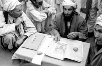 | Harrison Forman US Afghanistan men surrounding storyteller in Kabul market 1953 | MR Online