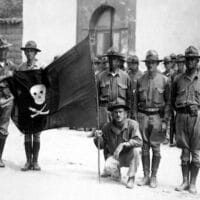 United States Marines with the captured flag of Augusto César Sandino in 1932