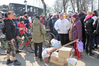| In a central area of Volnovakha Russian soldiers handed out humanitarian aid to lines of residents including bags of canned goods fresh bread water | MR Online