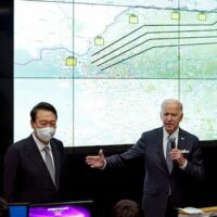 U.S. President Joe Biden, center right, with South Korean President Yoon Suk Yeol, center left, speaks at the Combat Operations Floor of the Osan Air Base, Sunday, May 22, 2022, in Pyeongtaek, South Korea. [AP Photo/Evan Vucci]