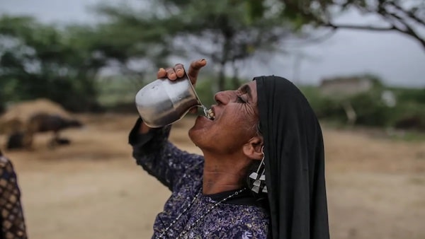 | An Indian woman drinks water on March 29 2022 during a fierce heat wave Image credit UNDP India | MR Online