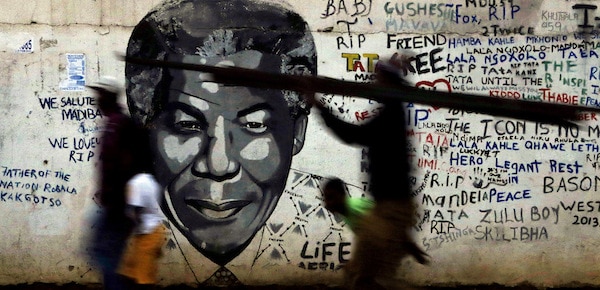 | People walk past a mural of former South African President Nelson Mandela in Katlehong south of Johannesburg South Africa | MR Online