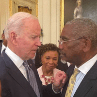 Pres. Biden and Cong Meeks confer close up (https://twitter.com/RepGregoryMeeks)