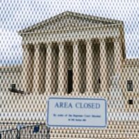 An anti-scaling fence surrounds the U.S. Supreme Court Thursday, May 5, 2022 in Washington. [AP Photo/(AP Photo/Alex Brandon)]