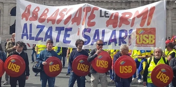 | USB union with banner reading Lower your weapons raise your wages | MR Online