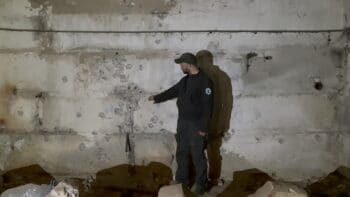 | Ilya Podkolzin points to a wall where bullets were fired just past prisoners who believed they were being executed | MR Online