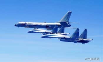 | Two Su 35 fighter jets and a H 6K bomber fly in formation on May 11 2018 The People | MR Online's Liberation Army (PLA) air force conducted patrol training over China's island of Taiwan.(Photo: Xinhua)