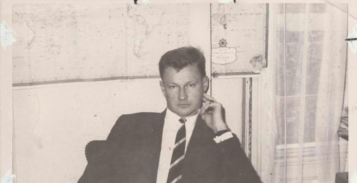 | archival photo of Zbigniew Brzezinski sitting in front of a world map | MR Online