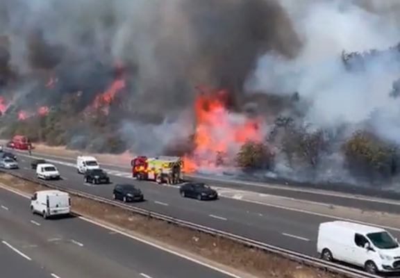 | Wildfires next to the A2 in Kent on the hottest day on record in Britain Still from video by Tim Cross | MR Online