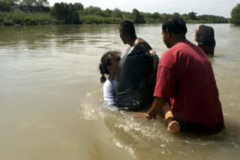 | Unidentified migrants who did not wish to give their names from the state of Jalisco Mexico cross the waters of the Rio Grande with the help of two coyotes or smugglers in an attempt to reach the US border in Nuevo Laredo Mexico May 18 2006 | German Garcia AP | MR Online