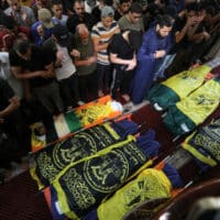 Mourners attend the funeral of seven Palestinians, including Islamic Jihad senior commander Khaled Mansour, who were killed in Israeli airstrikes on Rafah in southern Gaza, on 7 August 2022. Ashraf Amra APA images