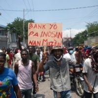 Sign: “Banks are not innocent in our misery”