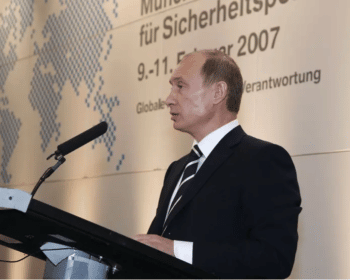 | Vladimir Putin speaking at 2007 Munich Security Conference Source blogsprioorg | MR Online