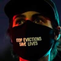 A demonstrator's mask reads "Stop Evictions Save Lives" during a protest in the Echo Park section of Los Angeles March 25, 2021. (AP Photo/Marcio Jose Sanchez)