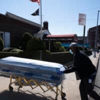 | In this March 27 2020 file photo William Samuels delivers caskets to the Gerard Neufeld Funeral Home during the coronavirus pandemic in the Queens borough of New York New data finds that life expectancy in the United States has dropped significantly over the past few years It is clear that racial minorities suffered the biggest impact but census information ignores the role of socioeconomic class | Mark Lennihan AP | MR Online