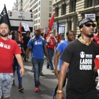 Amazon Labor Union members including Christian Smalls, Derrick Palmer and Tristian Martinez march from Jeff Bezos' penthouse to Times Square in a Labor Day 2022 protest.Photo by Nina Berman.