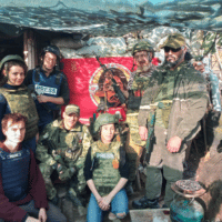 The author with Pyatnashka commanders at outpost near Avdeevka, Donetsk People’s Republic. [Source: Photo courtesy of Eva Bartlett]