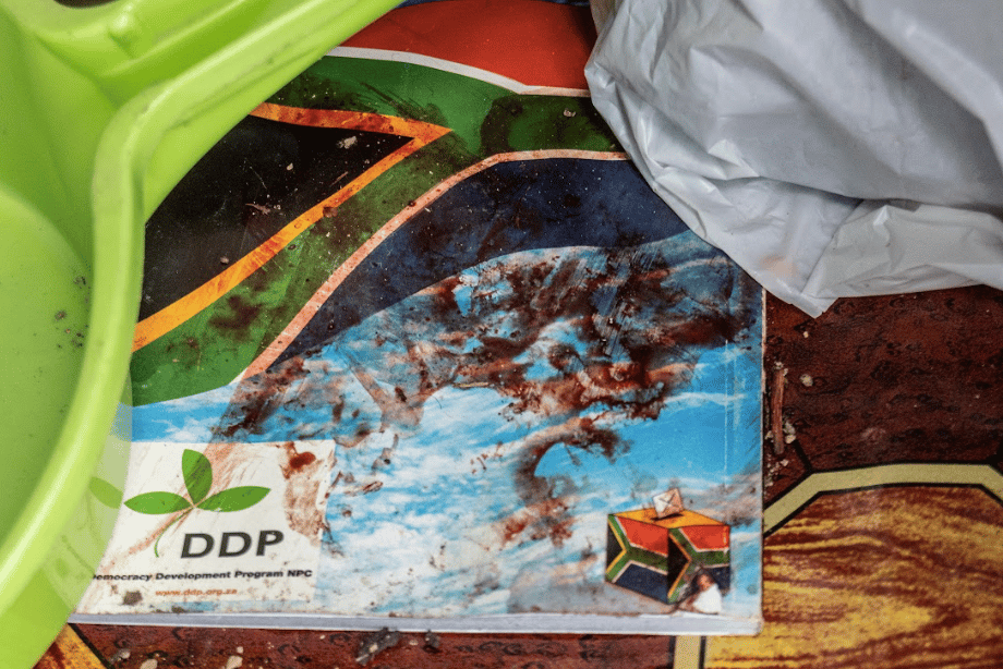 | A booklet titled Democracy Development Program NPC covered in the blood of slain leader Lindokuhle Mnguni inside his home Photo by Siyabonga Mbhele | MR Online