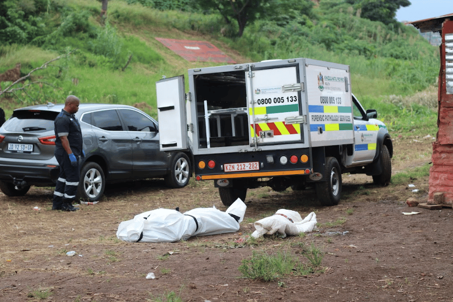 | March 8 2021 The body of Ayanda Ngila wrapped in a body bag while forensic police document the scene Ngila was gunned down in broad daylight by known suspects who opened fire on eKhenana residents who were on their way back from fixing a disconnected water pipe Photo and caption by Nomfundo Xolo | MR Online