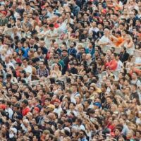 People at a crowded concert. Credit: CHUTTERSNAP / Unsplash