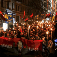 Torchlight parade behind portrait of Bandera on his birthday, Jan. 1, 2015. (Wikimedia Commons)