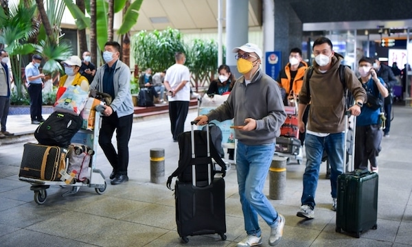 | Passengers walk out of Haikou Meilan International Airport on December 9 2022 Photo VCG | MR Online