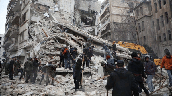 | Rescuers carry a victim on the rubble as the search for survivors continues in the aftermath of an earthquake in rebel held town of Jindires Syria February 7 2023 Source usnewscom | MR Online