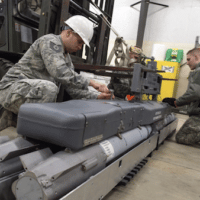 | Airmen with the 3rd Munitions Squadron assemble a rack of inert small diameter bombs during readiness training at Joint Base Elmendorf Richardson Alaska Feb 9 2018 The small diameter bomb is a precise and accurate weapon that allows the the F 22 Raptor to deliver decisive air power US Air Force photo by Alejandro Peña | MR Online