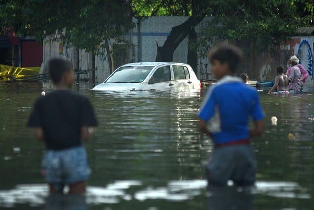 | A car is partially submerged after heavy rains in Chennai India 12 November 2021 | MR Online