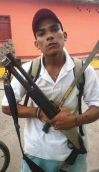 | Anti Ortega demonstrator brandishing gun Source photo courtesy of Nan McCurdy | MR Online