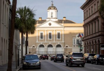 | Traffic drives along Broad Street toward the Old Exchange and Provost Dungeon in Charleston the site of slave auctions Davila researched Public auctions were held outside on the building | MR Online's north side.