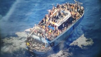 | A handout image provided by Greece | MR Online's coast guard on Wednesday, June 14, 2023, shows scores of people covering practically every free stretch of deck on a battered fishing boat that later capsized and sank off southern Greece, leaving at least 79 dead and many more missing. [AP Photo/Hellenic Coast Guard via AP]