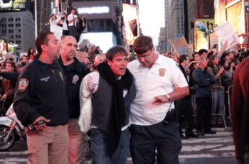 | Randy Credico being arrested by police in Times Square Source Photo courtesy of Stephen Brown | MR Online