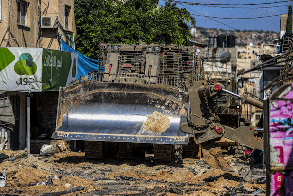 | AN ISRAELI MILITARY BULLDOZER SEEN LEVELING ROADS AND DESTROYING THE CENTER OF THE JENIN REFUGEE CAMP DURING A RAID ON THE CAMP NEAR THE WEST BANK CITY OF JENIN JULY 3 2023 PHOTO NASSER ISHTAYEHSOPA IMAGES VIA ZUMA PRESS WIREAPA IMAGES | MR Online