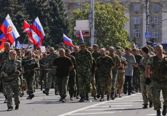 | Donbas separatists escort a column of Ukrainian prisoners of war C as they walk across central Donetsk Ukraine on August 24 2014 Source businessinsidercom | MR Online