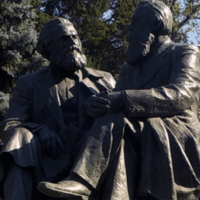 Statues of Karl Marx and Friedrich Engels in Bishkek, Kirghizstan. Source: Wikicommon / cropped from original / shared under license CC BY-SA 4.0