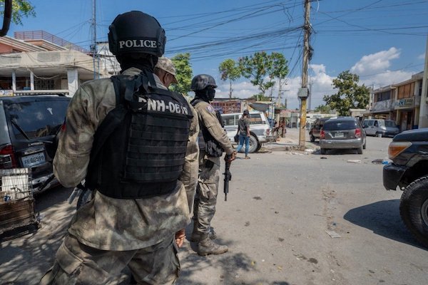 | Police officers patrol a street in the Haitian capital of Port au Prince courtesy Marvens CompèreHaitian Times | MR Online