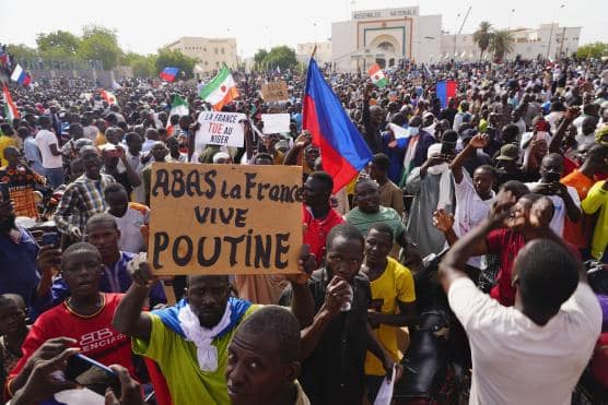 | Nigeriens participate in a march called by supporters of coup leader Gen Abdourahmane Tchiani in Niamey Niger July 30 2023 Poster reads Down with France long live Putin | MR Online
